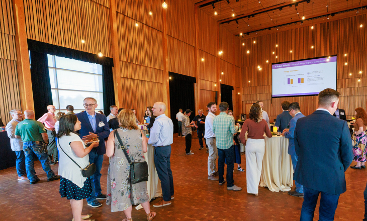 People connecting in large foyer.