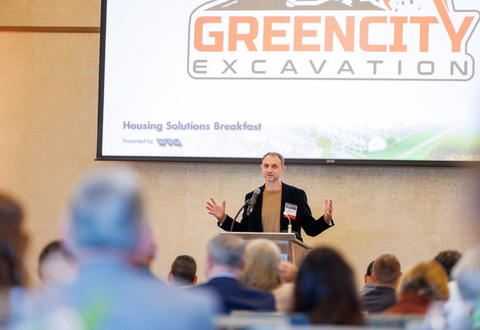 presenter in front of a screen