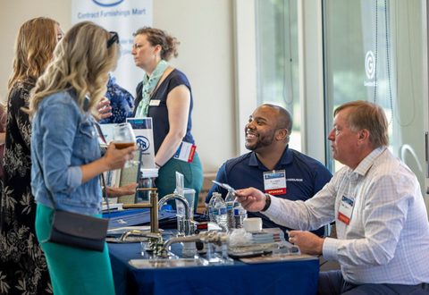 vendor connecting with attendee at conference