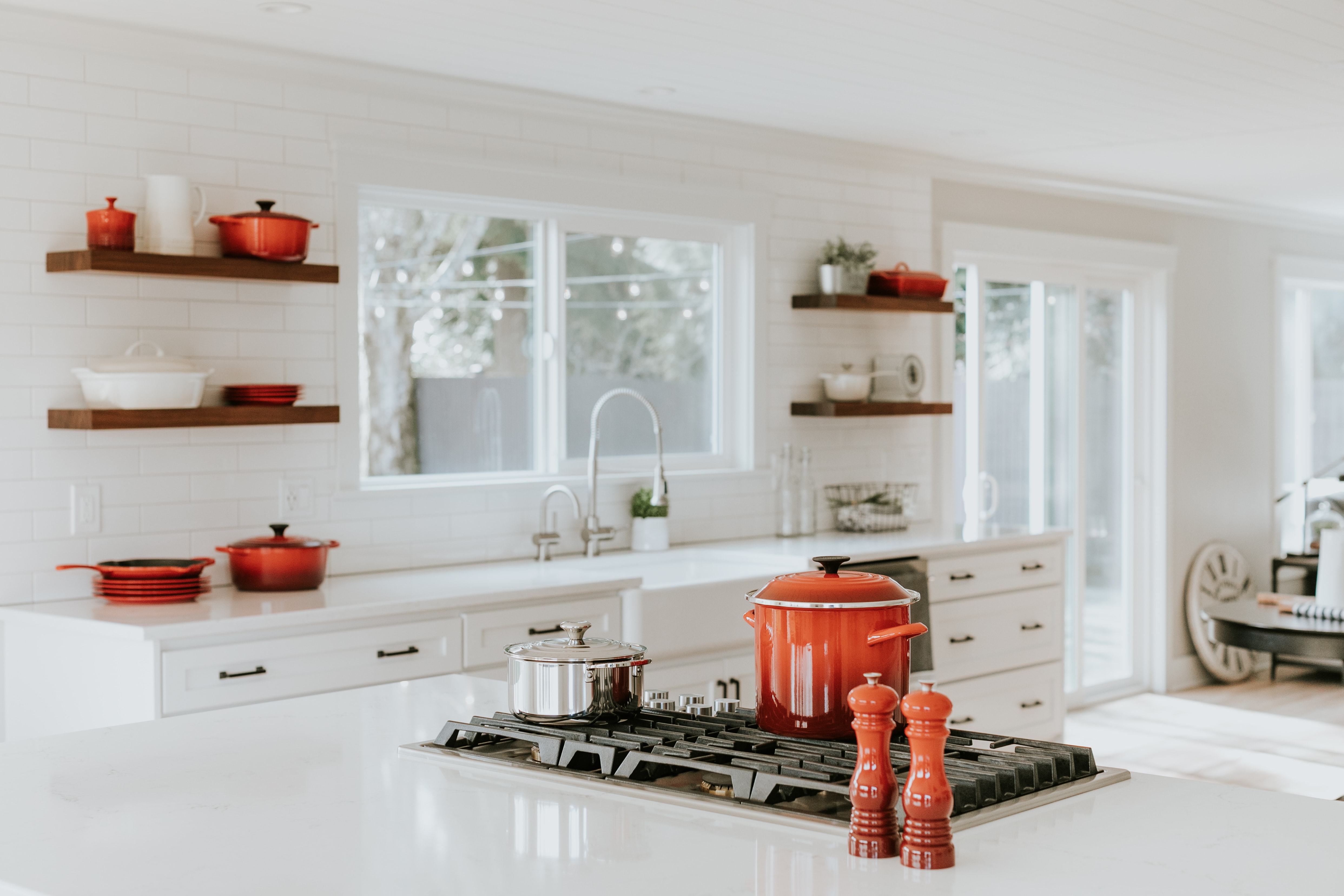 Remodeled Kitchen with Red Cookware on stovetop