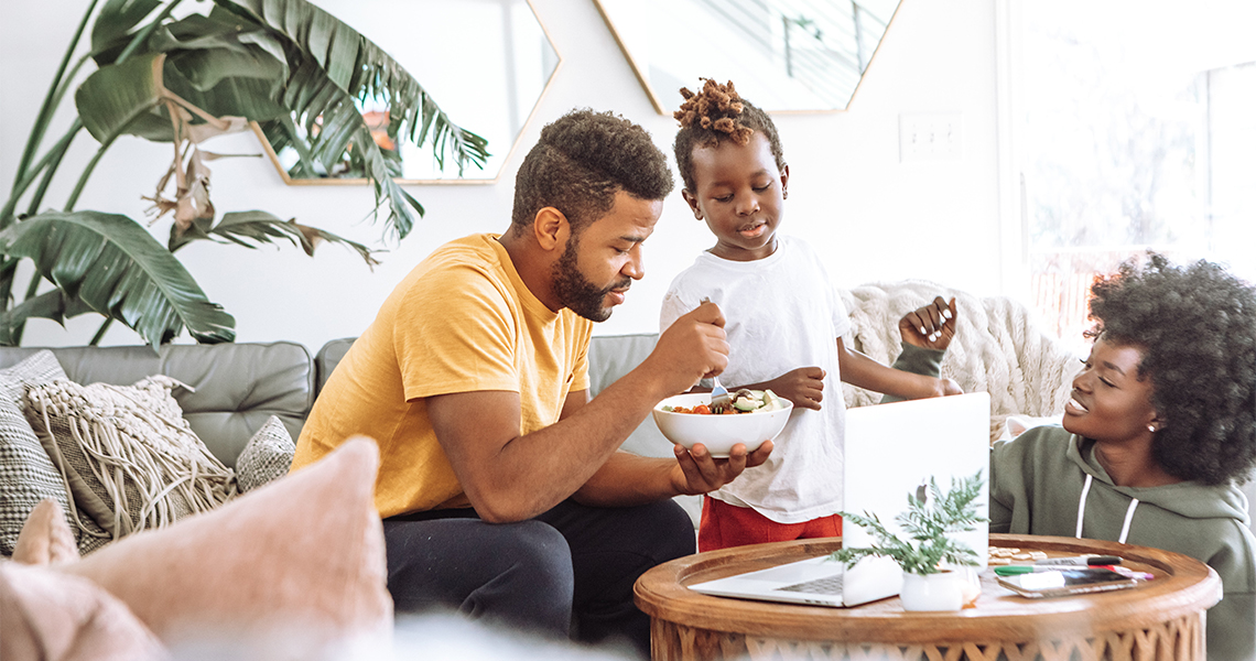 Young Black family sharing a meal