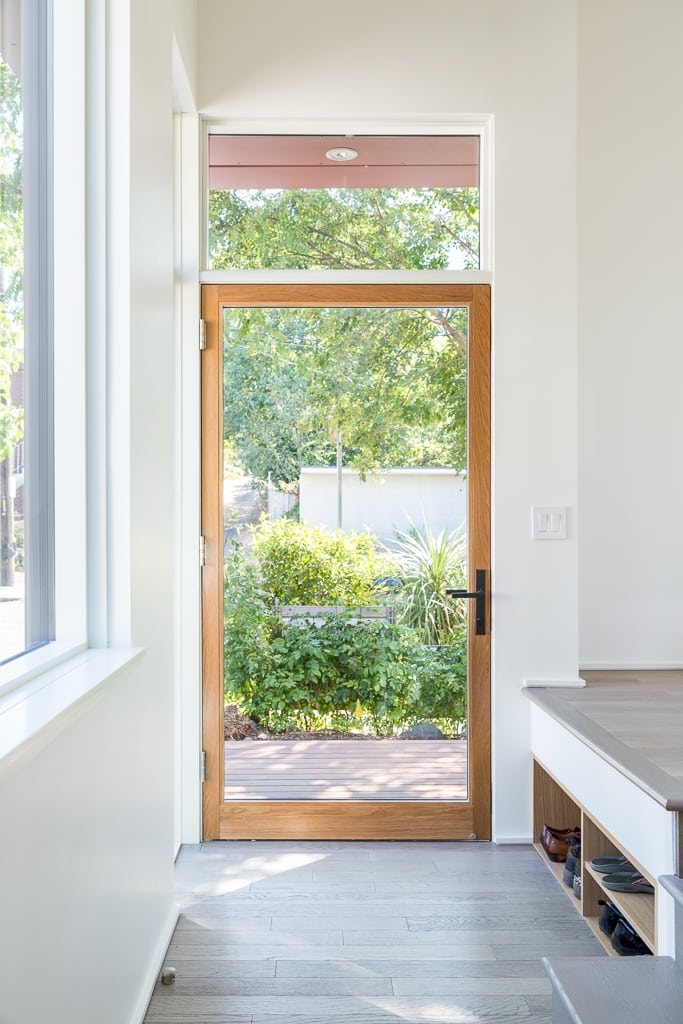 Contemporary home featuring a built-in shoe storage area, built by Model Remodel and designed by CAST Architecture. Photo by Cindy Apple Photography.