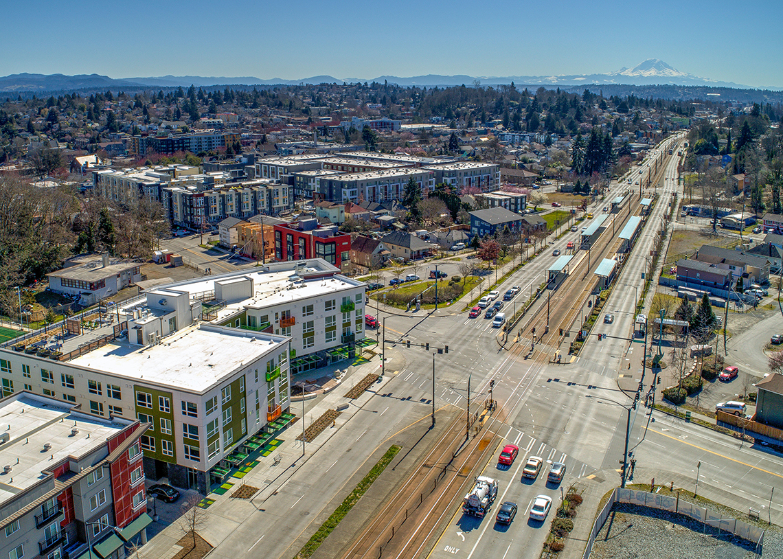 BDR Holdings Sonata Apartments at Columbia Station Built Green 4-Star exterior with mountain view and nearby light rail. Photo credit: Heiser Media