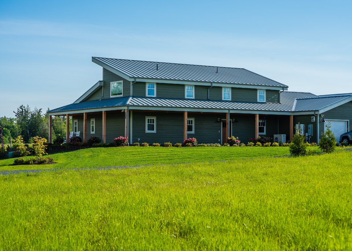 TC Legend Everson Net-Positive home exterior, photo credit Zigzag Mountain Art