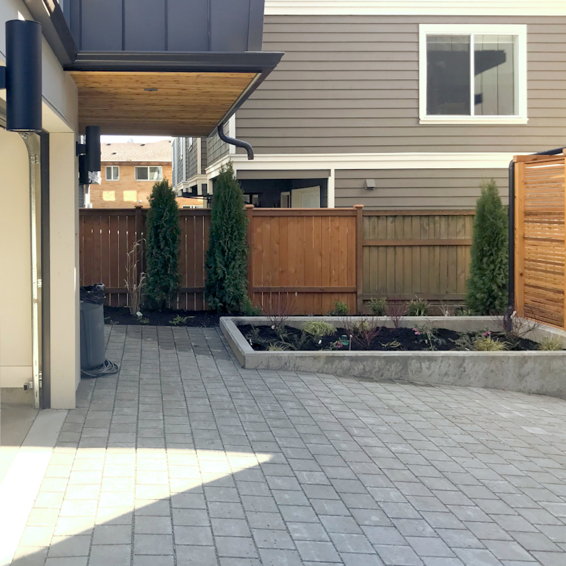 nwBuilt Built Green 5-Star Ballard townhomes exterior with pervious paving