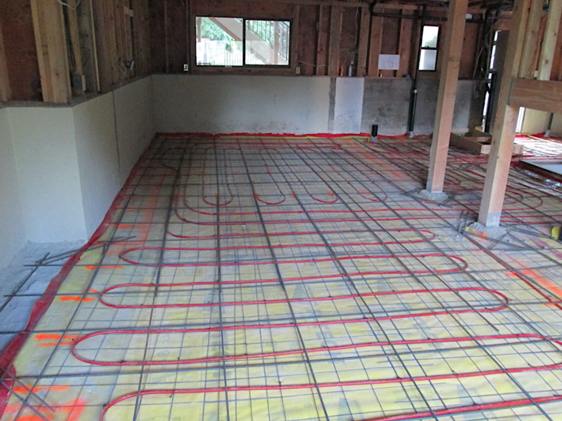 Hydronic floor heating in a Seattle basement remodel (Photo: Model Remodel)