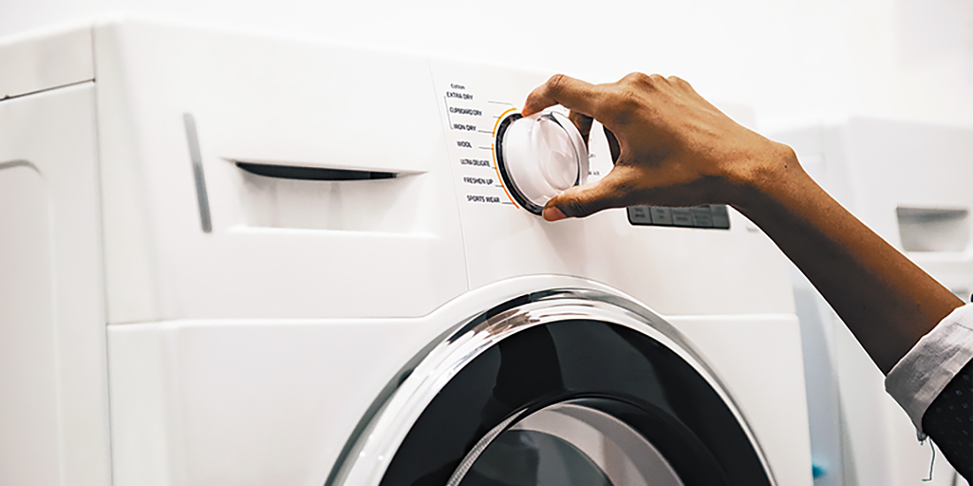 Homeowner using a washing machine