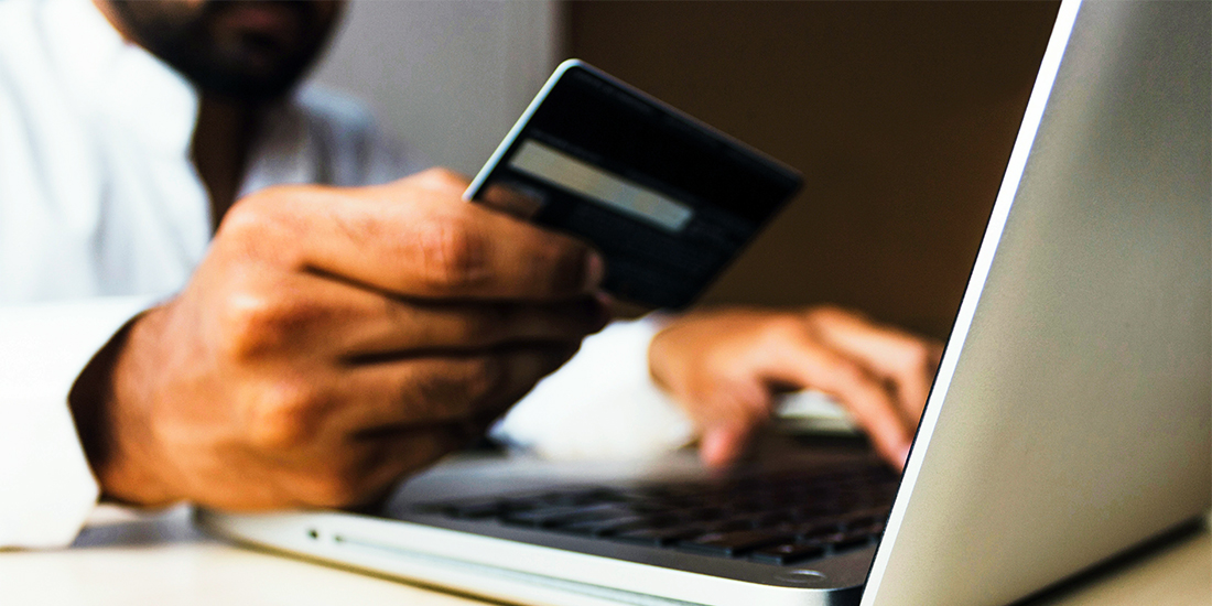 A man shops online with a credit card