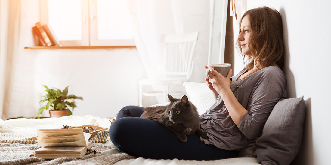 Peaceful woman lounging with cat