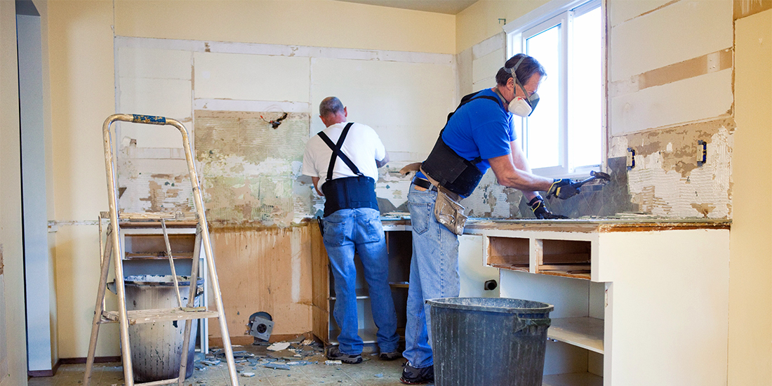 Workers remodel a kitchen